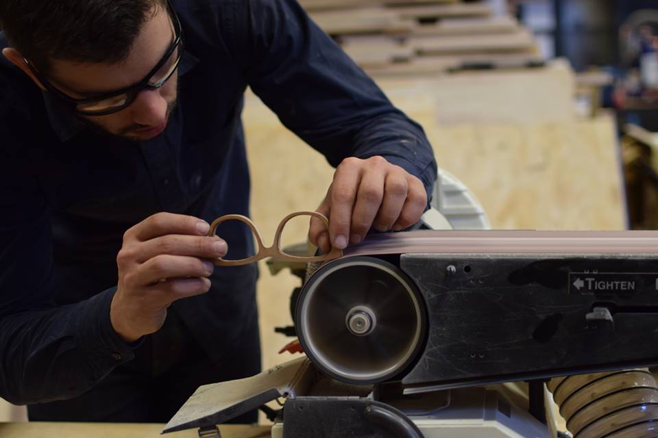 A vendor making glasses