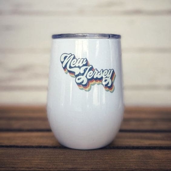 12 oz insulated wine glass with plastic lid and New Jersey design.