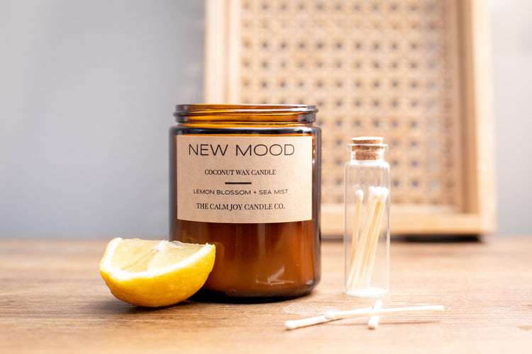 Coconut wax candle with wood wick in 7.5 oz amber glass jar